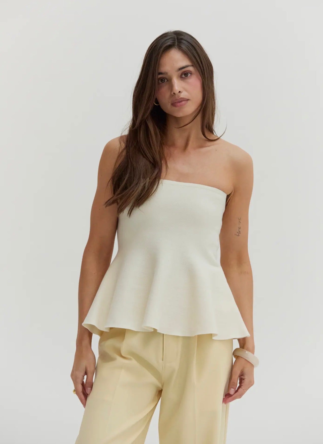 Off white peplum strapless top