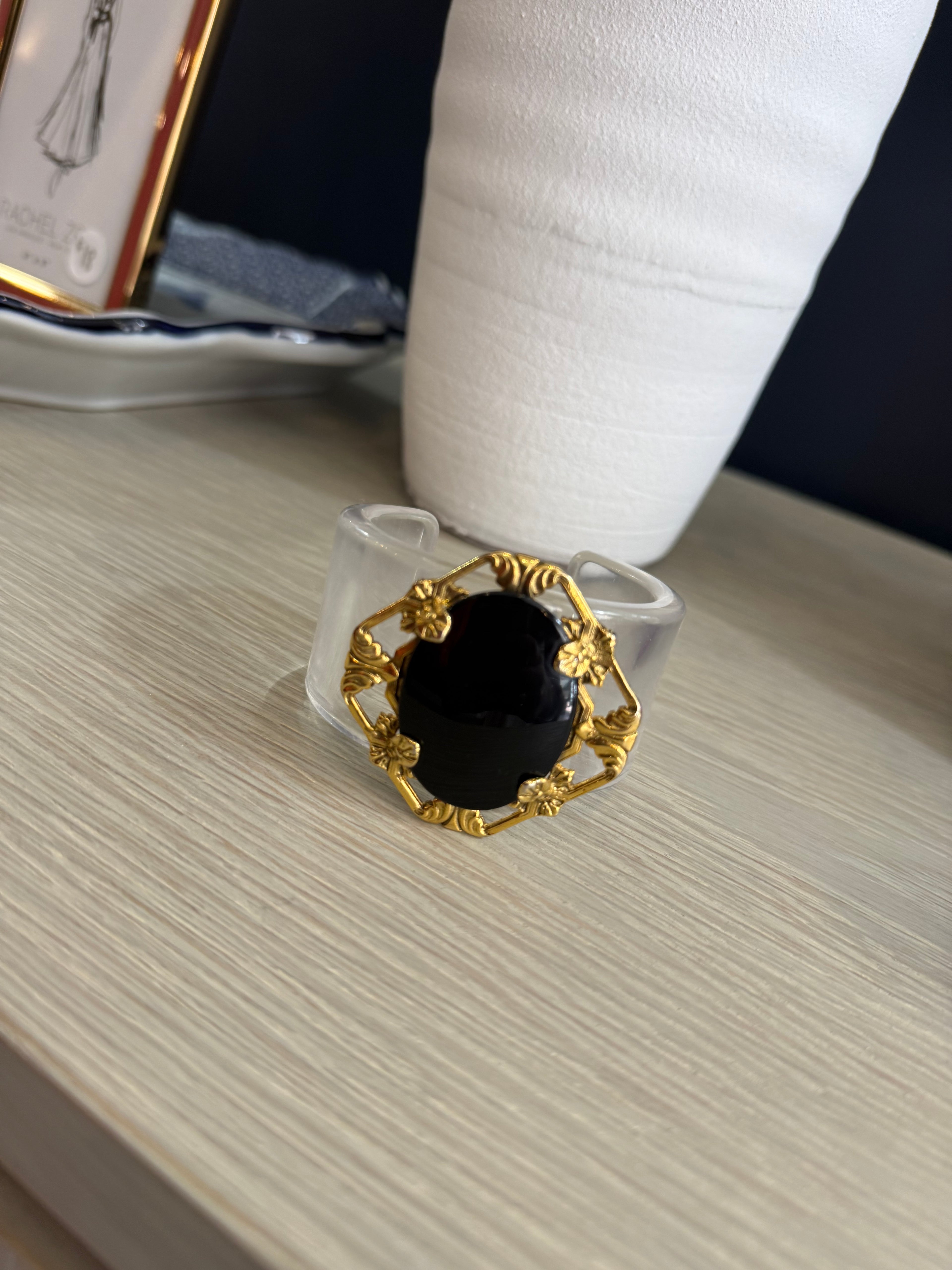 Acrylic cuff with vintage brooch