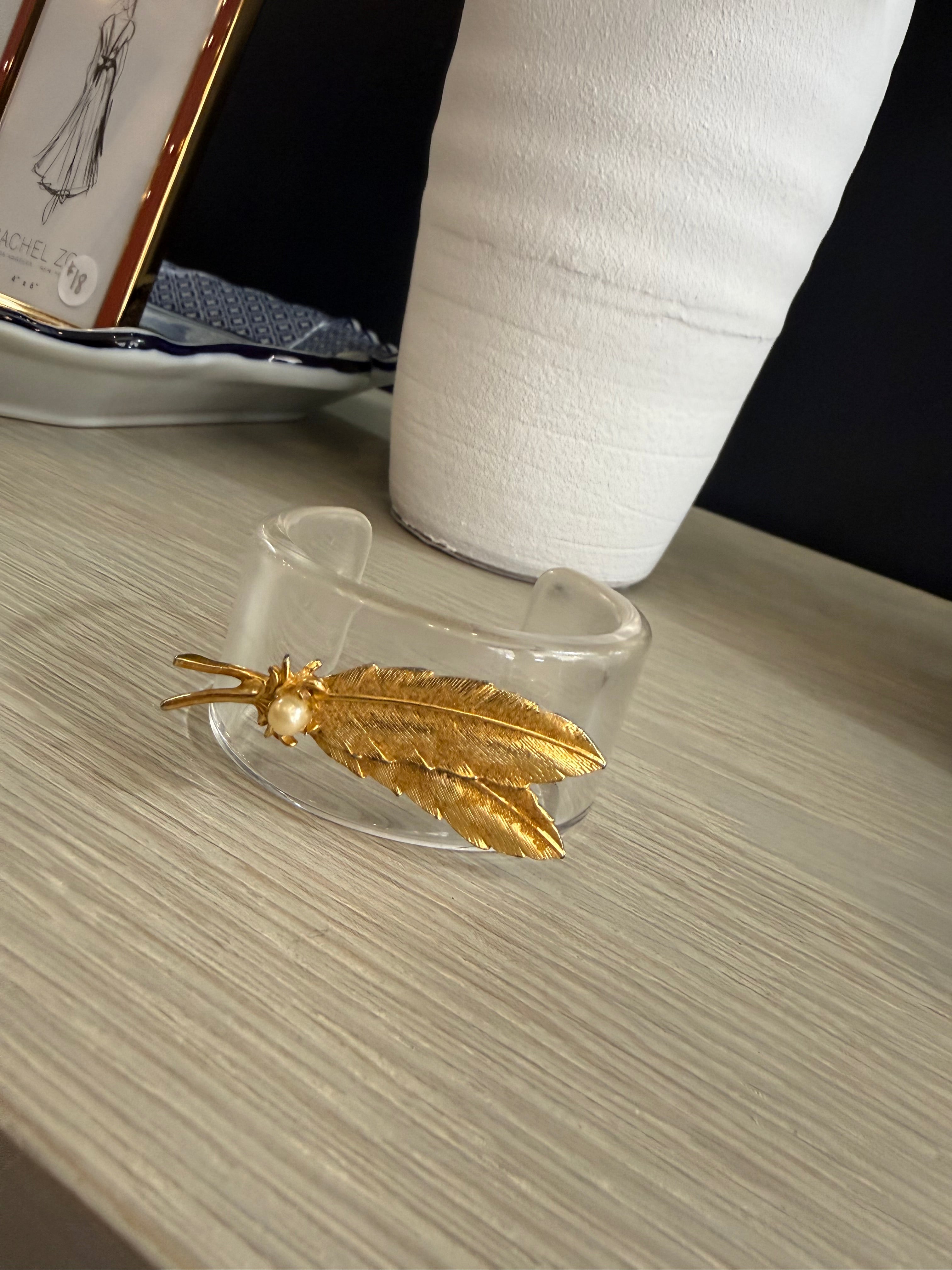 Acrylic cuff with gold leaf brooch