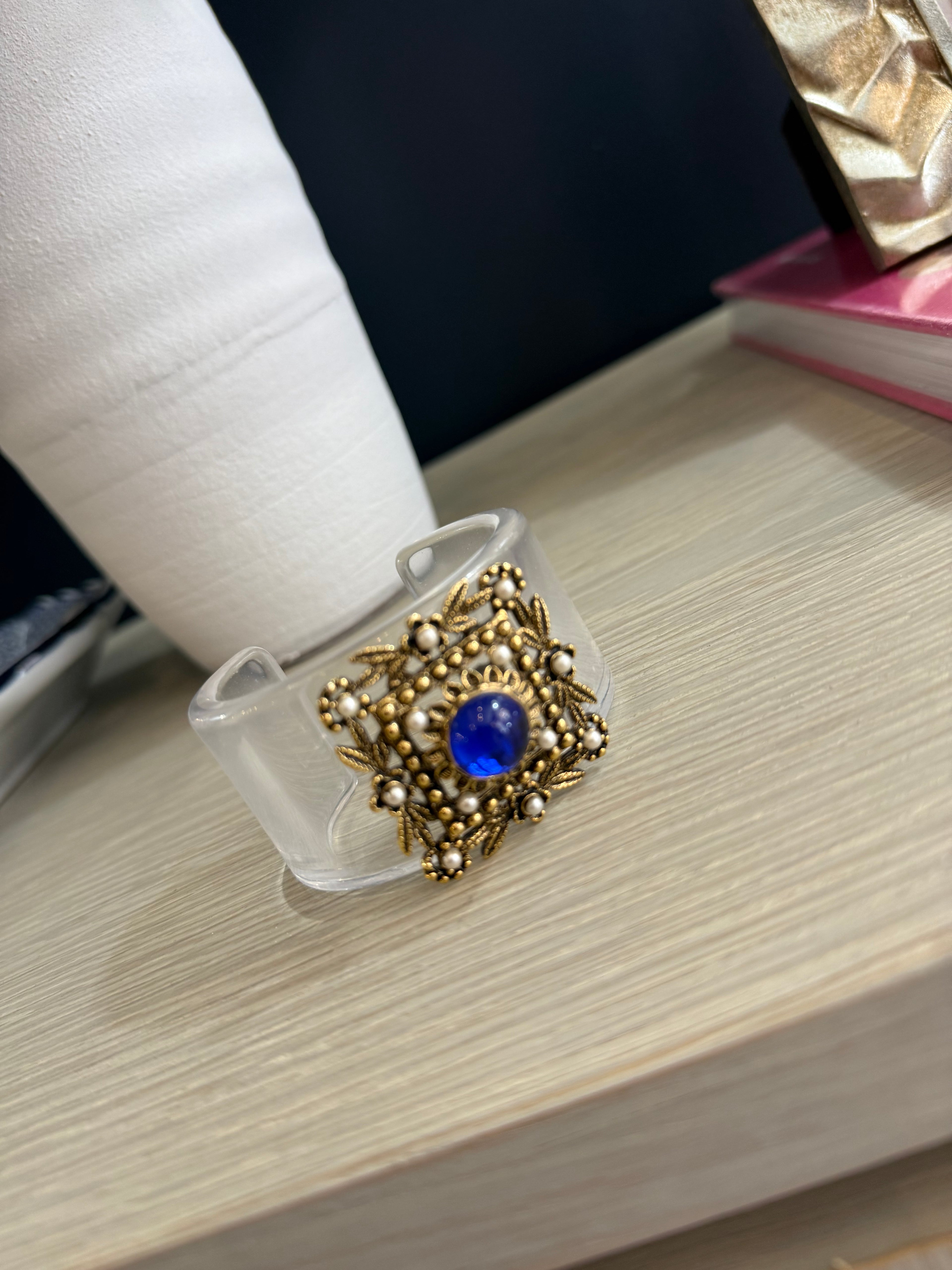 Acrylic cuff with vintage brooch